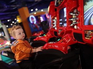 boy-on-amusement-bike-at-indoor-playground